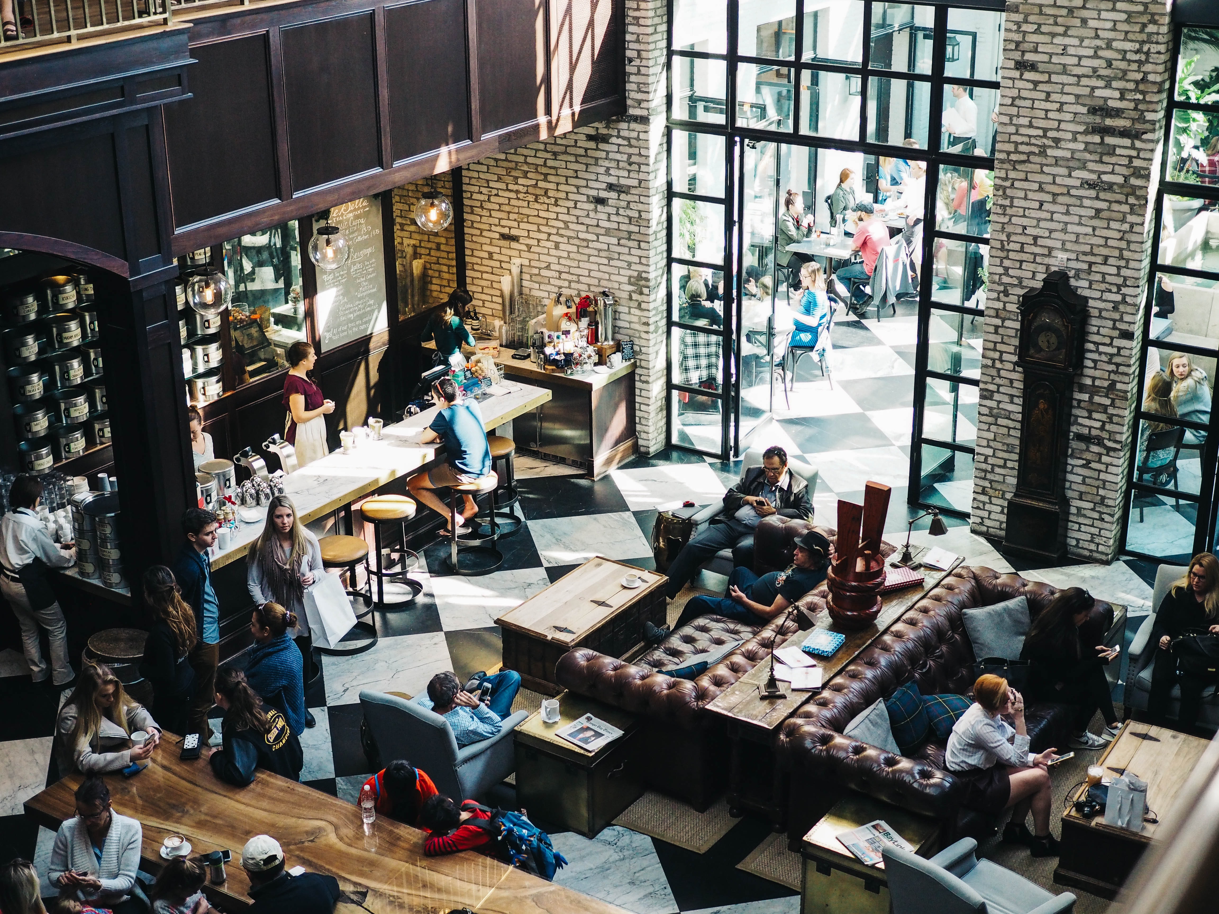 Looking down into a busy coffee shop lobby.